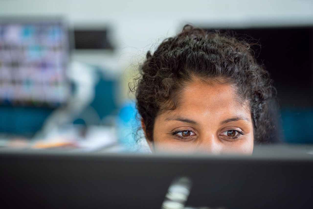 Woman, work, office — The Pros & Cons of E-Cigarettes vs Traditional Cigarettes